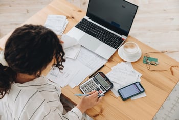 An executive assistant working on a budget 