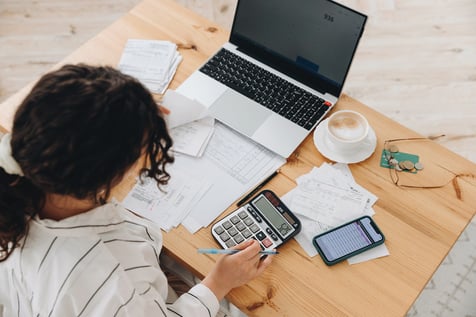 An executive assistant working on a budget 