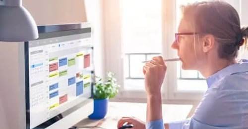 executive_assistant_looking_at_a_busy_calendar
