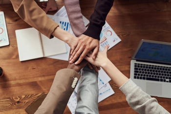 A group of people shaking hands