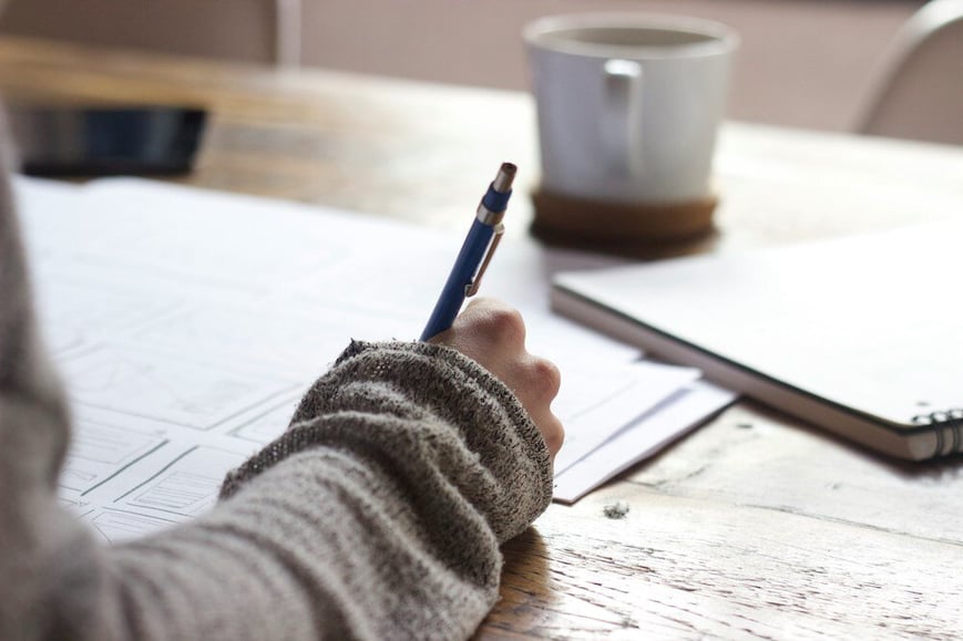 A female EA writing down her accomplishments